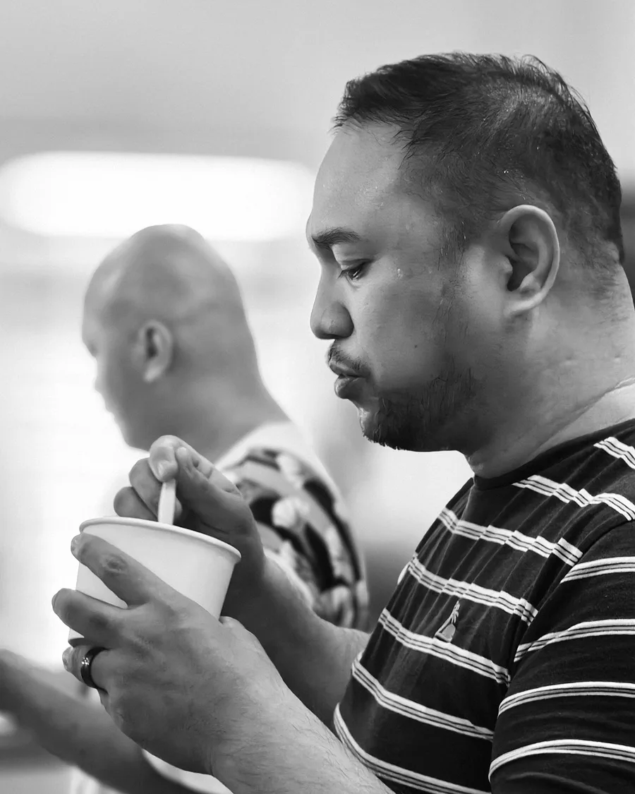 A choir member enjoying a snack