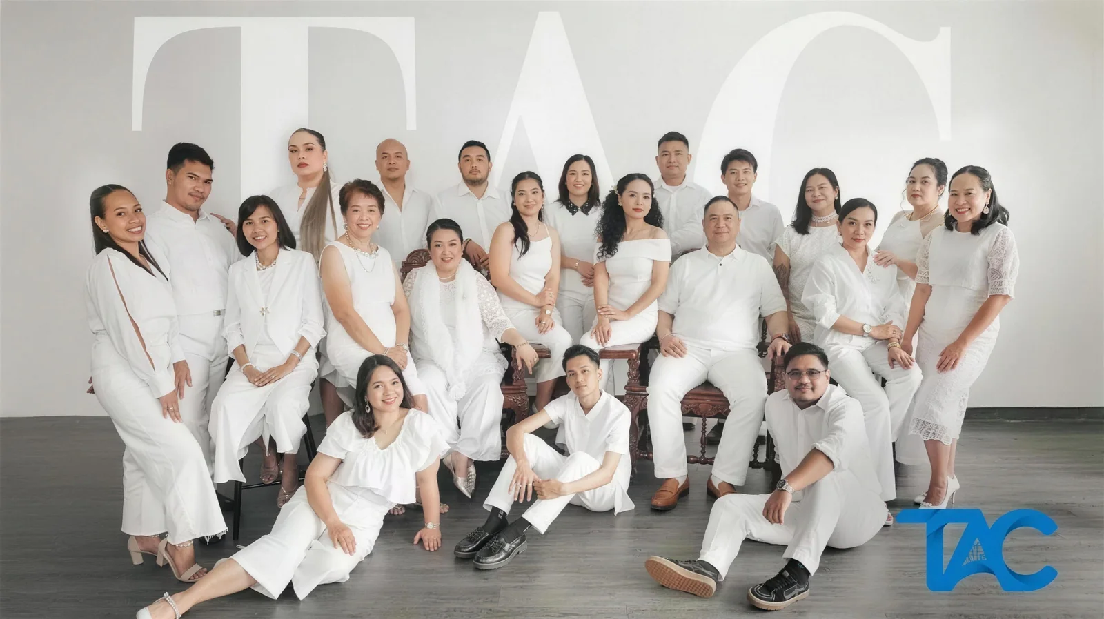 Members of The Assumptionist Choir dressed in white for their 2025 photoshoot