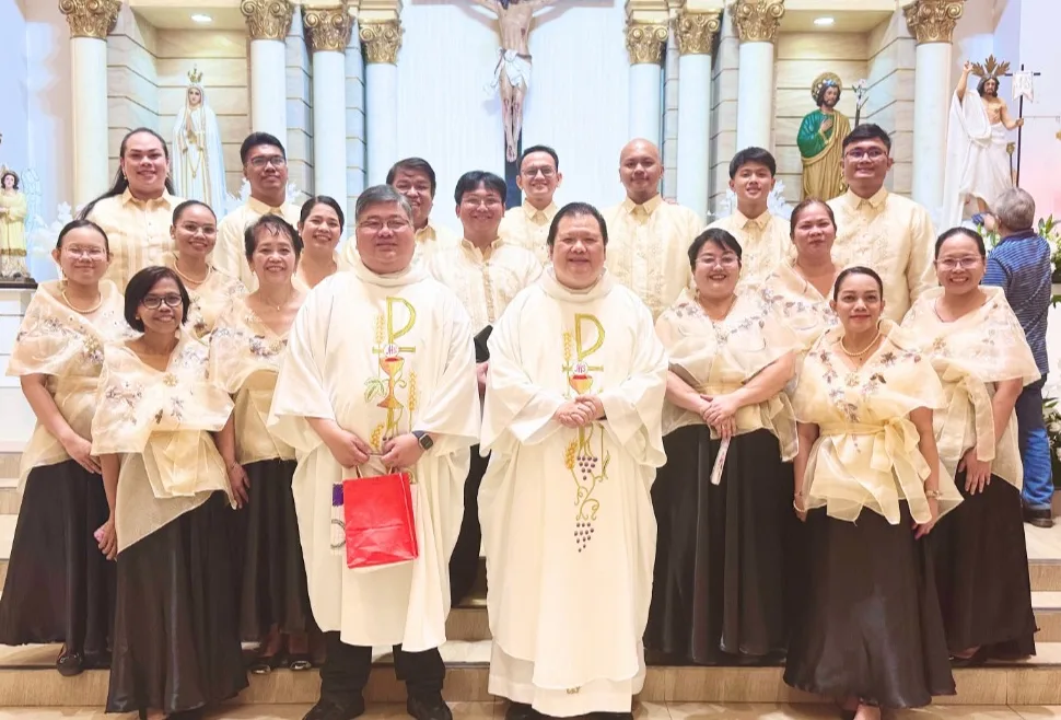 The choir in barong and Filipiniana with priests at the altar after Mass