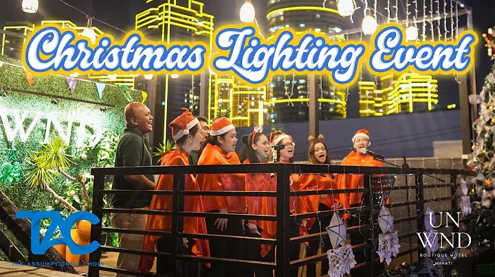 The choir caroling at the UNWND Boutique Hotel Christmas lighting